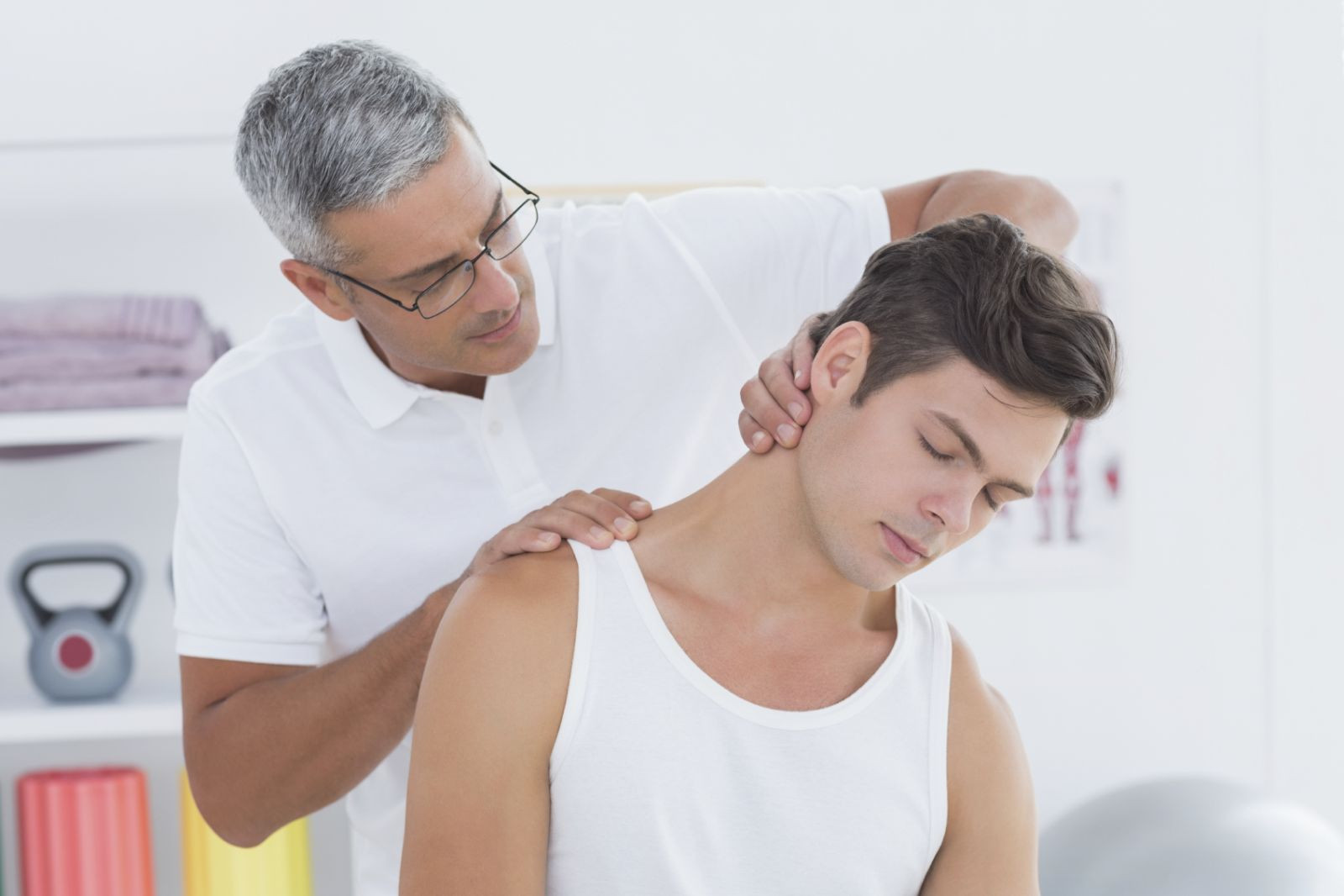 Doctor giving treatment for neck pain relief